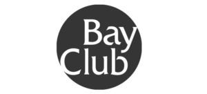 Bay Club in white letters inside a black circle
